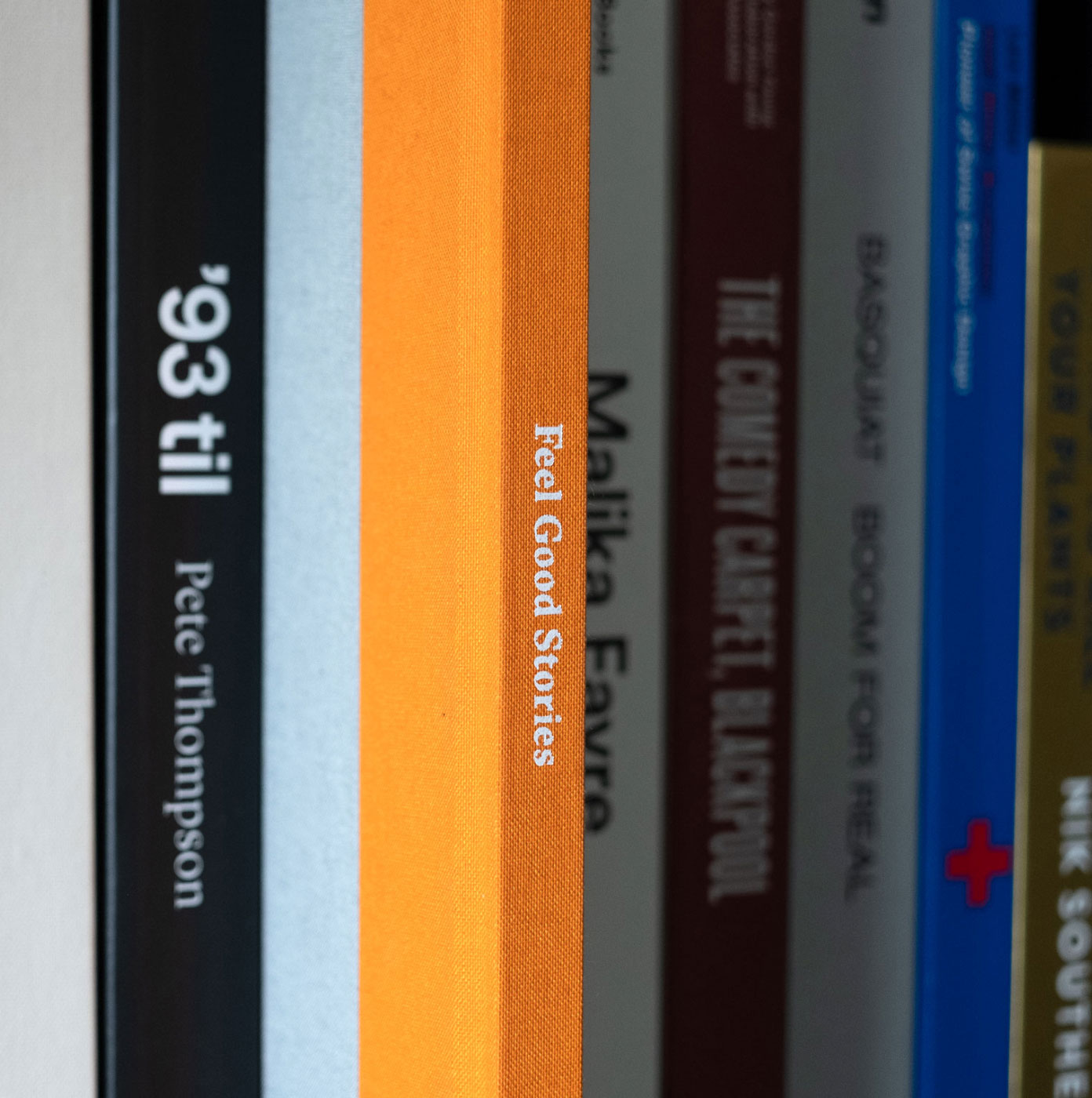 Spine of Feel Good Stories in amongst a bookshelf